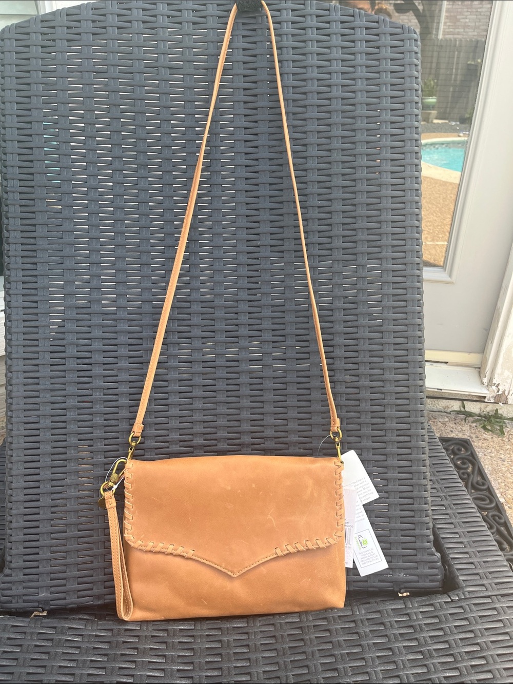 The Sak Tan Leather Crossbody with Whipstitch Accent - Picture 1 of 7